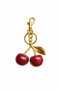 Cherry | Elegante colgante para bolso con acabado dorado
